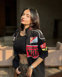 Anushka Sen in a sleek Black Ferrari Jacket, showcasing a trendy motorsport-inspired look.