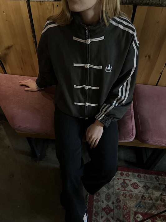 Female model wearing the viral Gigavibe Black Tang jacket streetwear