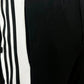 Trendy unisex snap button trousers styled with sneakers