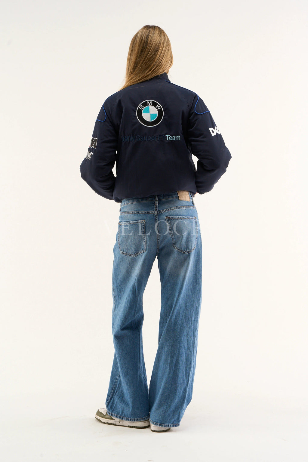 BMW M Power logo close-up on Petronas racing jacket sleeve – navy printed design