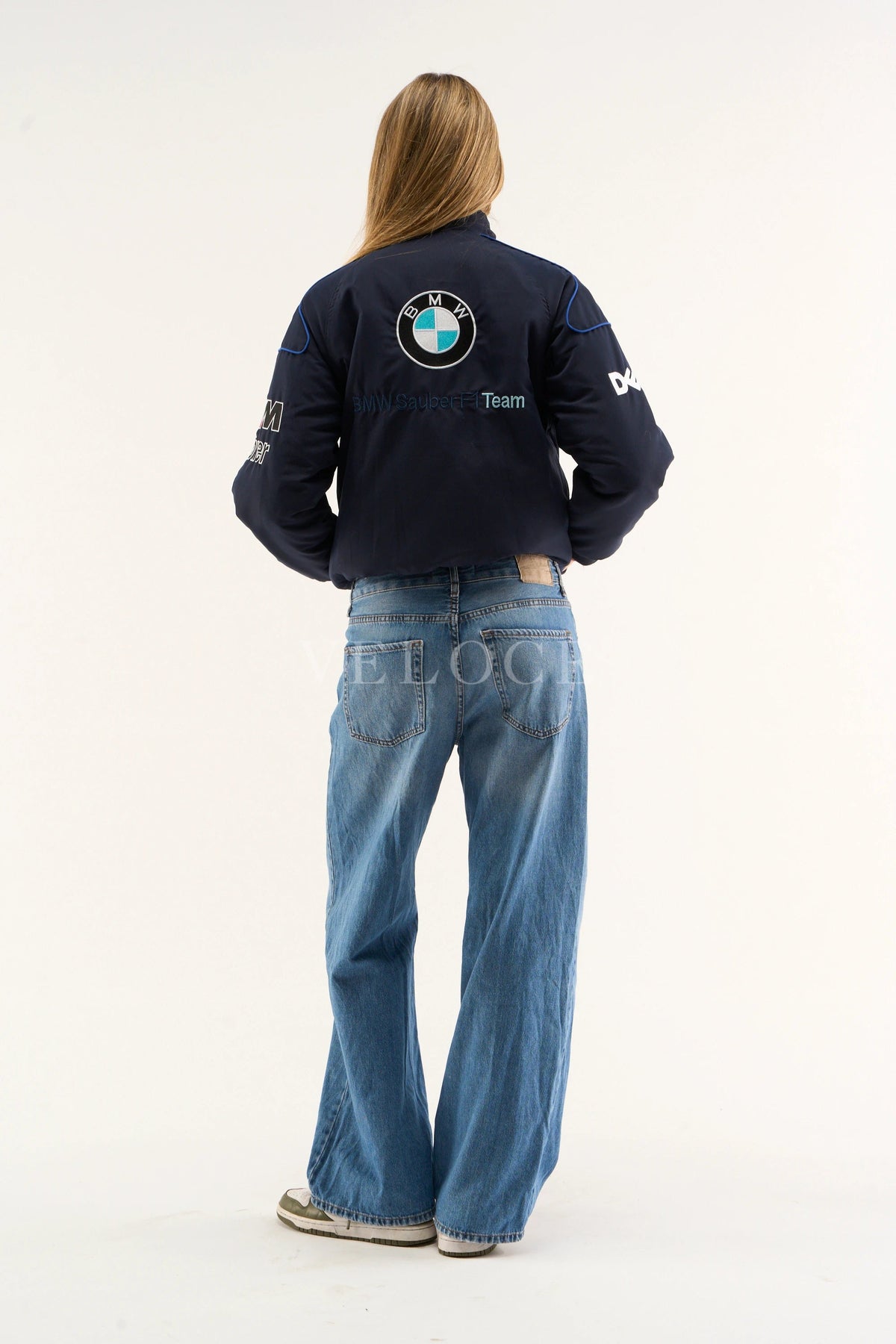 BMW M Power logo close-up on Petronas racing jacket sleeve – navy printed design