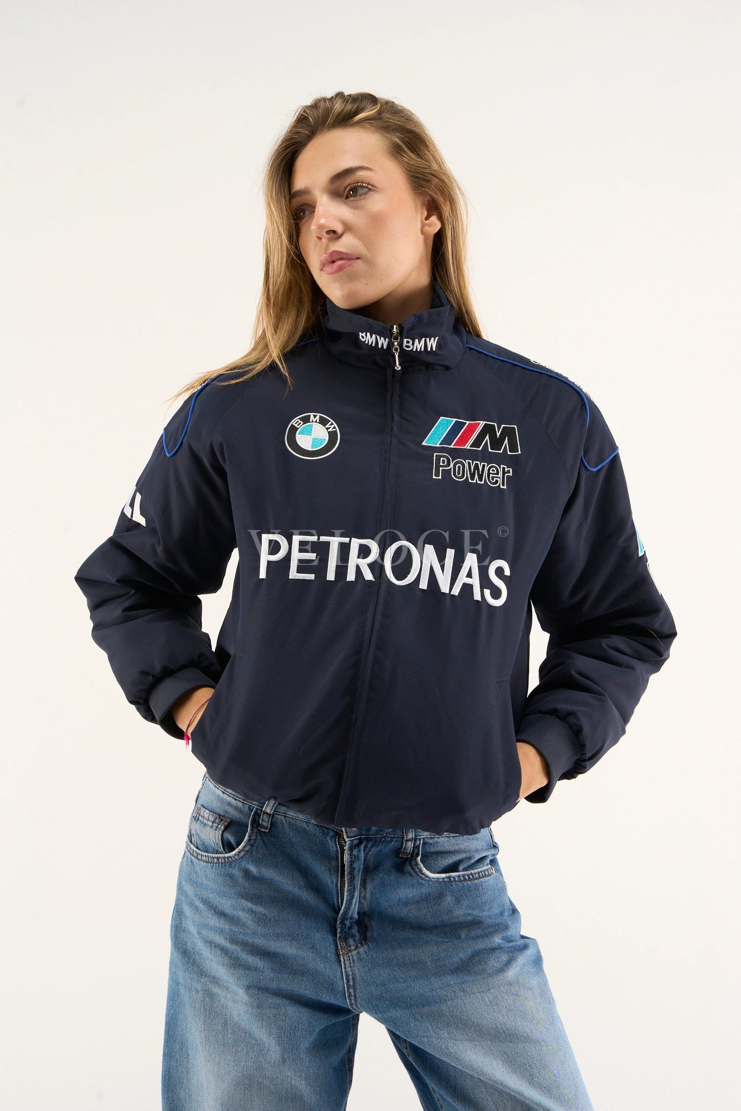 BMW M Power logo close-up on Petronas racing jacket sleeve – navy printed design