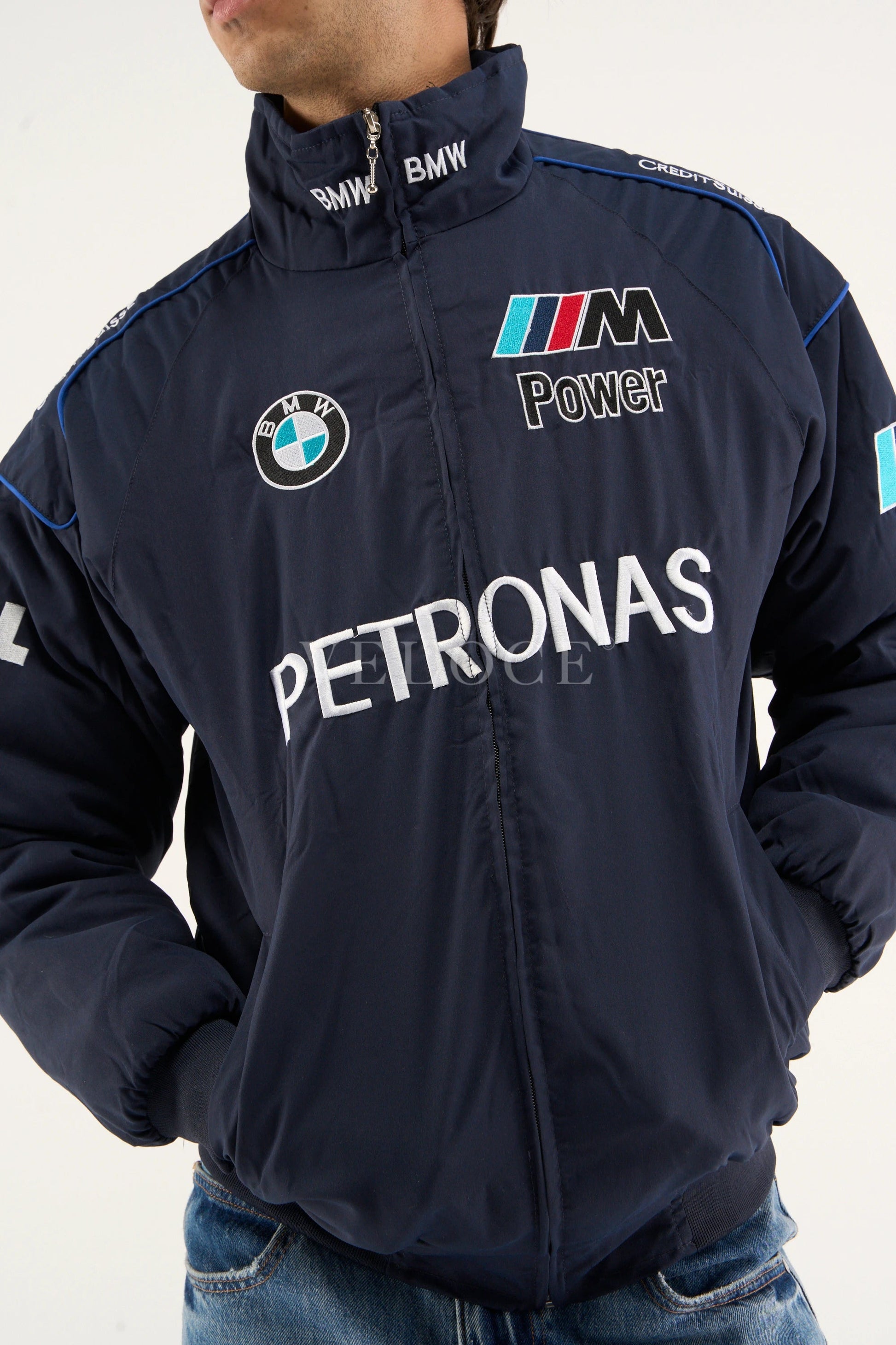 BMW Petronas F1 racing jacket close-up showcasing printed BMW M Power logo on chest