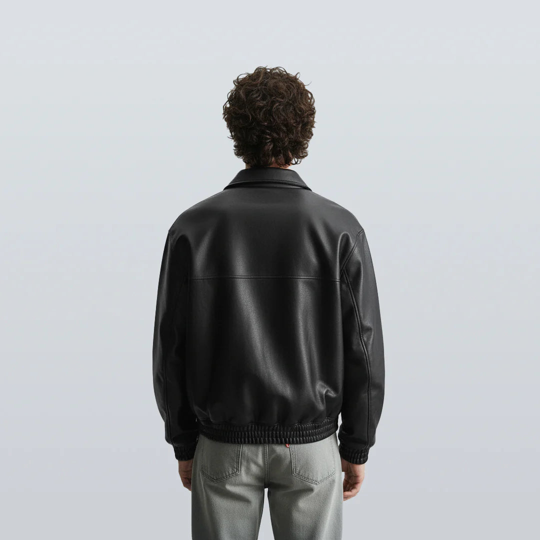 Back view of black bomber leather jacket unisex with ribbed hem and smooth leather texture, perfect for winter wear