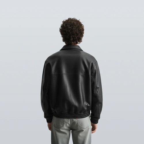 Back view of black bomber leather jacket unisex with ribbed hem and smooth leather texture, perfect for winter wear