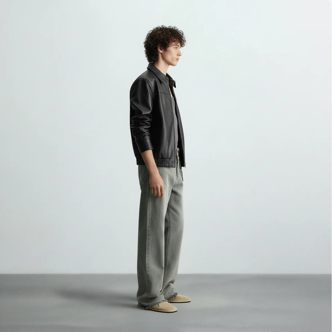 Side view of black bomber leather jacket for men and women, showcasing slim fit design and premium faux leather finish by Gigavibe