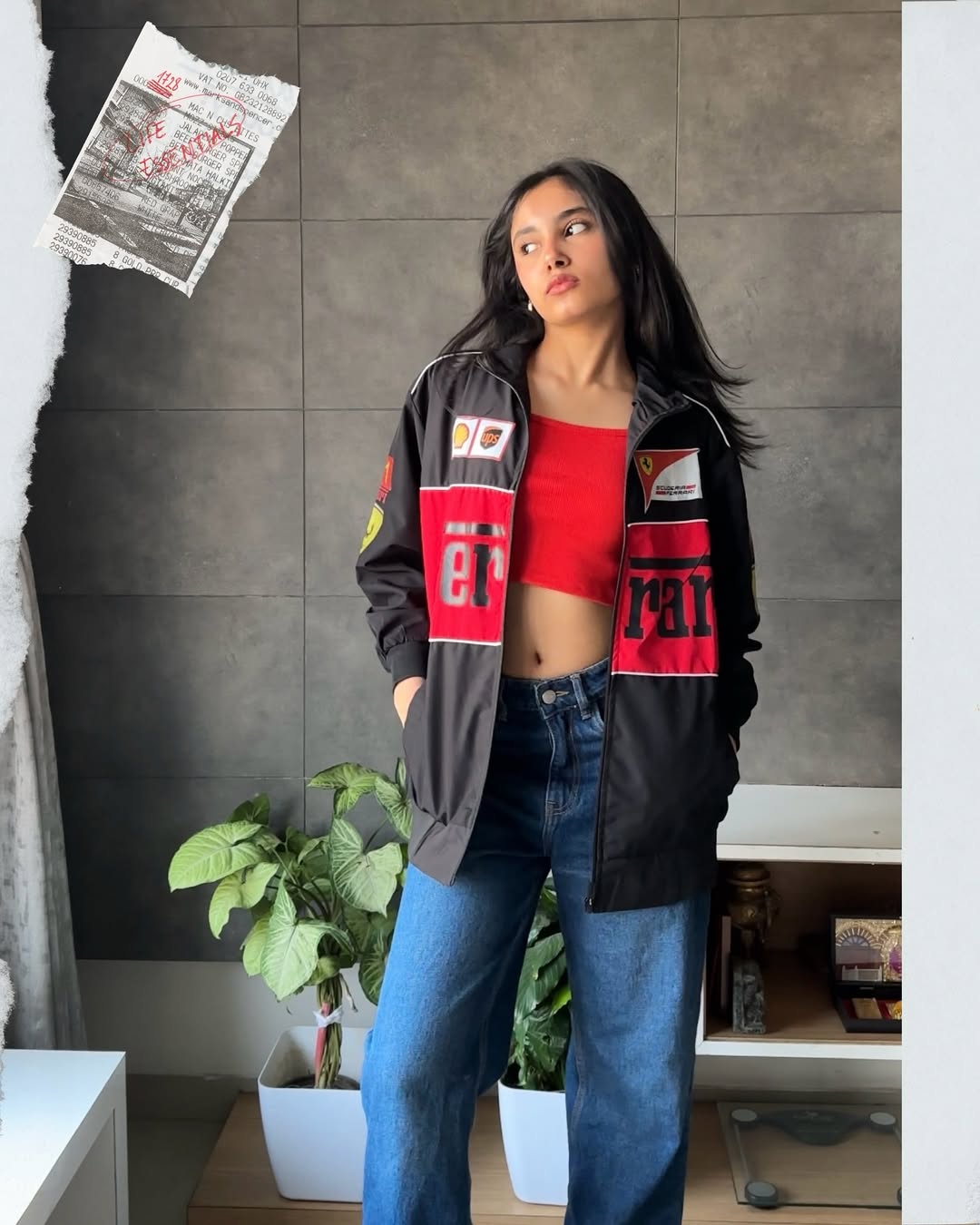 Black Ferrari bomber jacket styled with crop top and denim for streetwear look