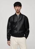 Model wearing a Premium black leather bomber jacket with classic bomber style fit on a plain background