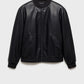 Detailed texture of premium genuine black leather bomber jacket material