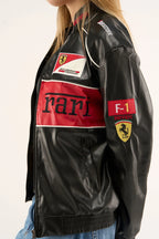 Side view of ferrari red black leather jacket showing scuderia ferrari patch, F1 sleeve detail, and premium leather texture