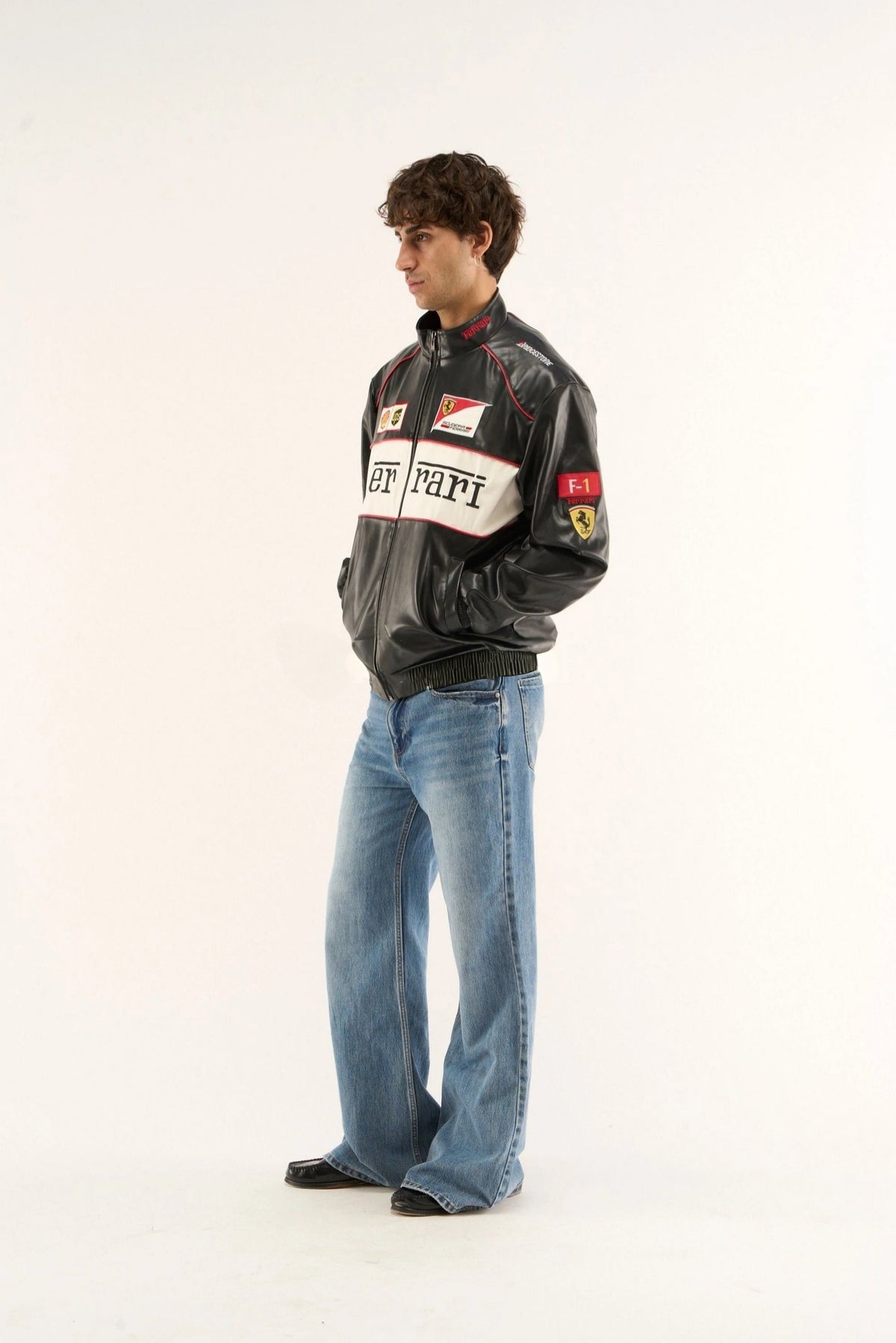 Black white racing jacket styled with jeans for streetwear look inspired by Ferrari motorsport culture