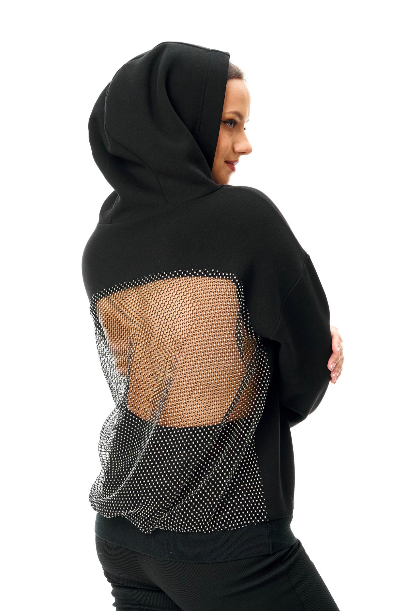 Side back angle of Gigavibe rhinestone sparkle hoodie highlighting backside sparkle hoodie crystal design, premium streetwear black hoodie for women with breathable mesh detailing, luxury sparkle finish, and modern fashion styling suitable for parties and streetwear looks