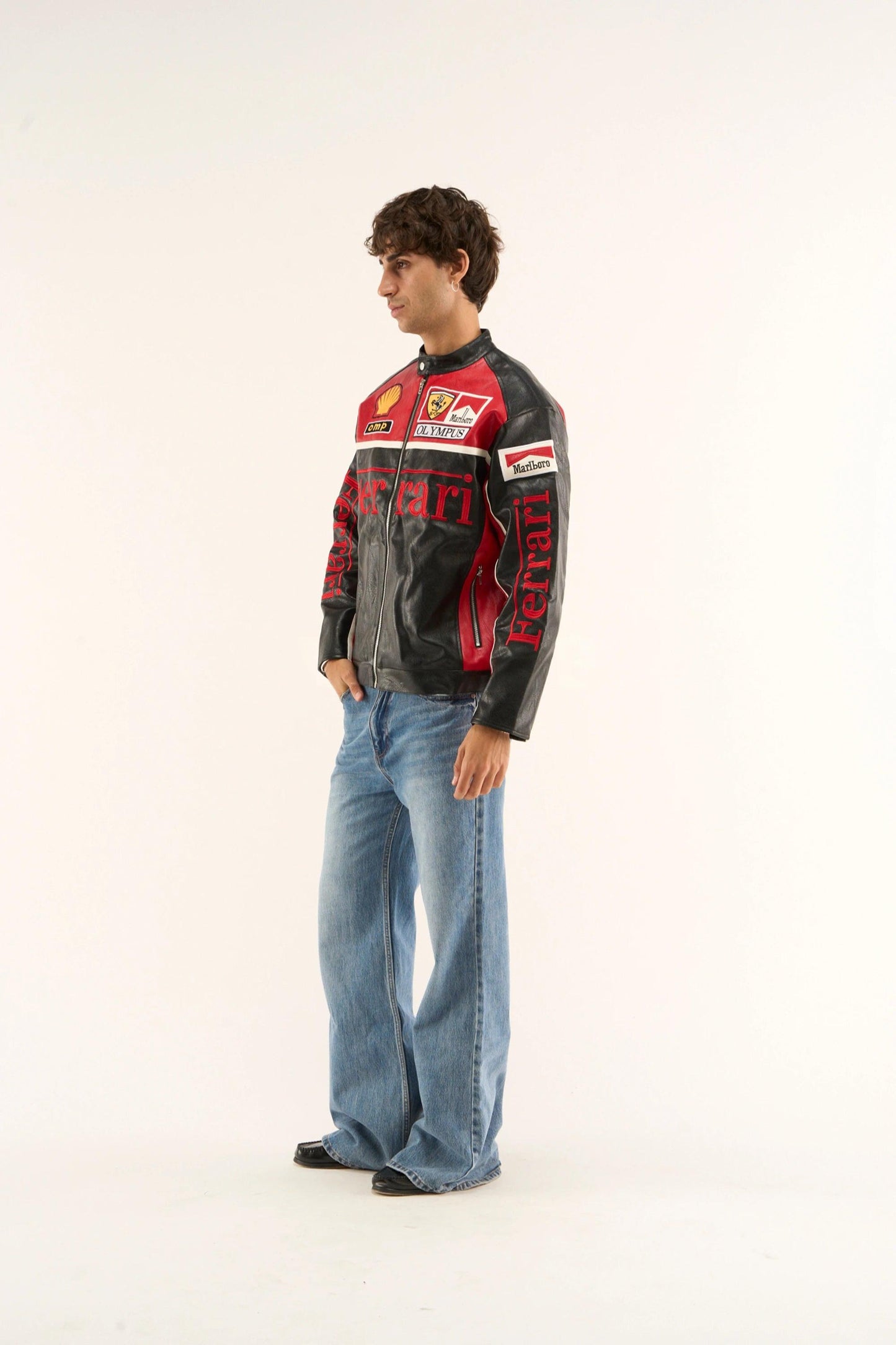 Side-angle shot of Ferrari Olympus leather jacket featuring bold racing stripes.