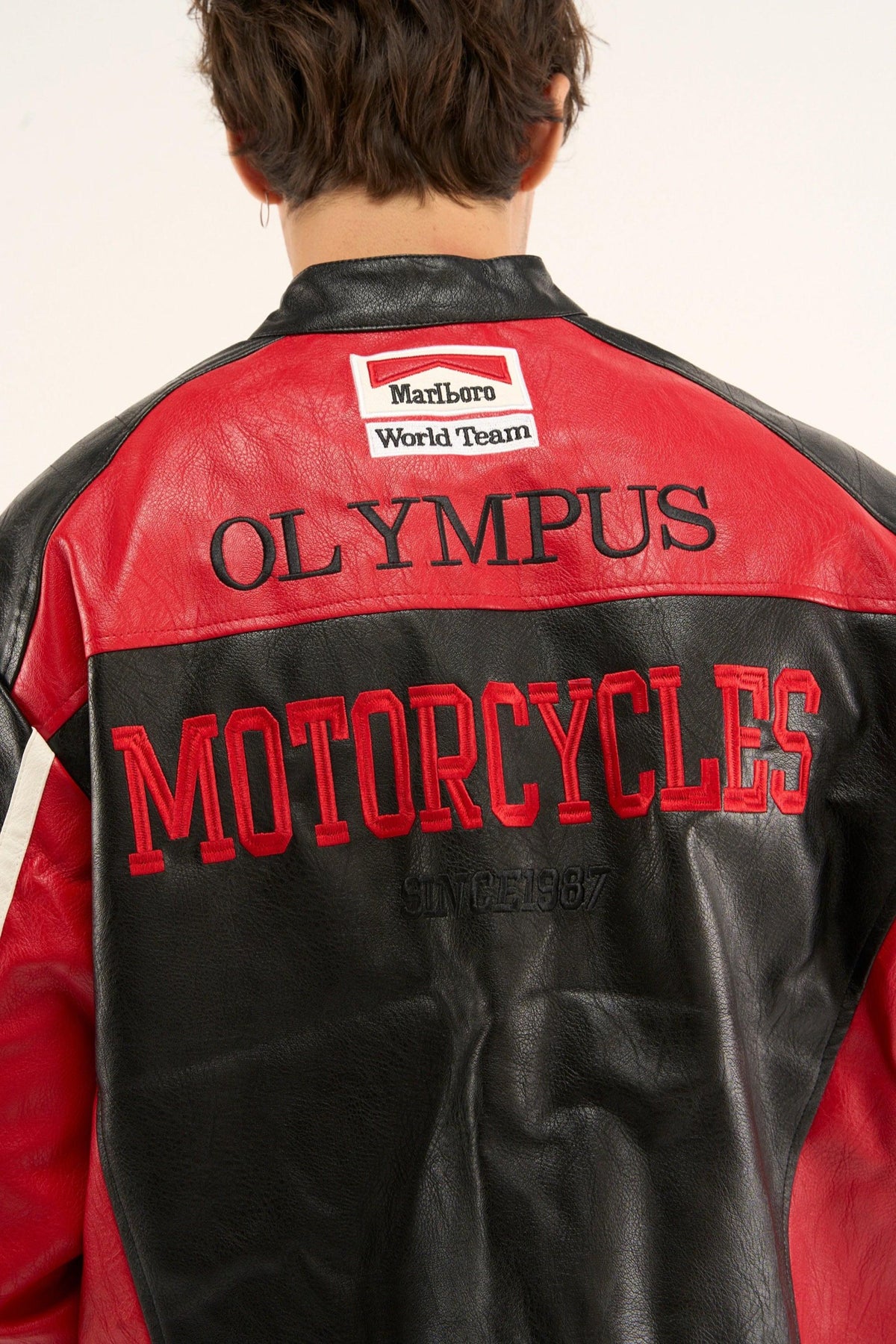 High-quality leather texture close-up on Ferrari Olympus motorsport jacket.