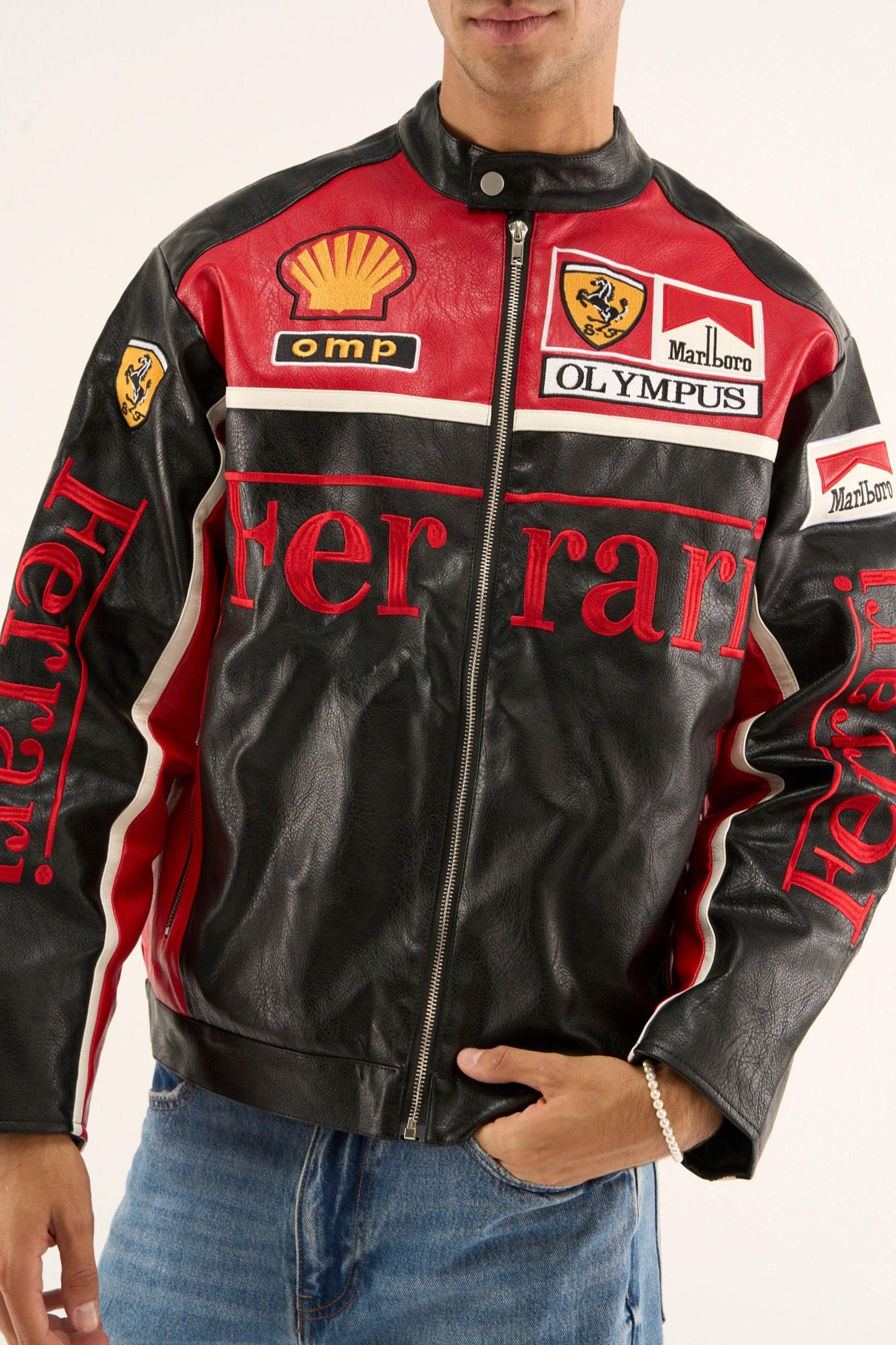 Close-up of Ferrari Olympus Jacket showcasing stitched motorsport branding.