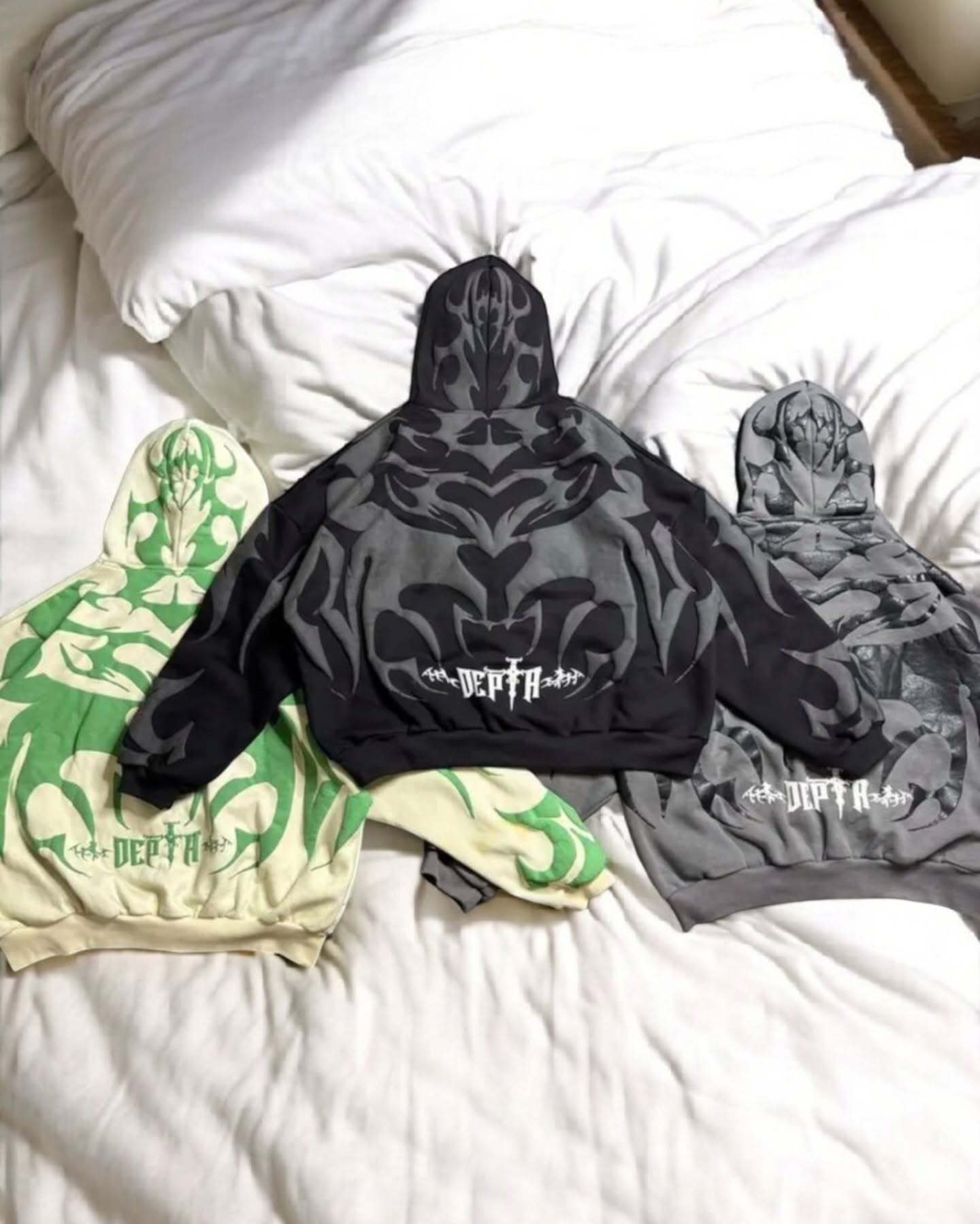 Gigavibe Depth Hoodie product lineup – black, white, and beige variants