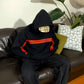 Person wearing a I Love You This Much Hoodie by Gigavibe with red accents sitting on a brown leather couch.