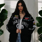 Women wearing a Premium Jack Daniels jacket modern look multiple brand logos.