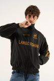 Male model wearing Gigavibe Lamborghini jacket embroidered black racing jacket with gold detailing and high-neck design.