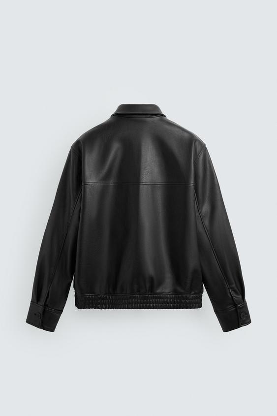Black leather jacket on a light gray background