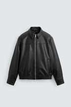 Black faux leather bomber jacket zipper and pocket detail
