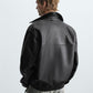 Men wearing a Black leather bomber jacket back view with ribbed cuffs on a white background