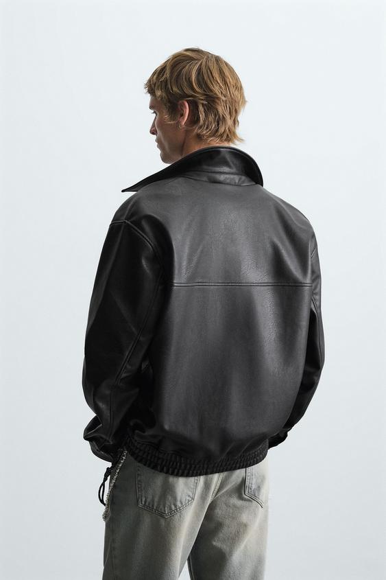 Men wearing a Black leather bomber jacket back view with ribbed cuffs on a white background