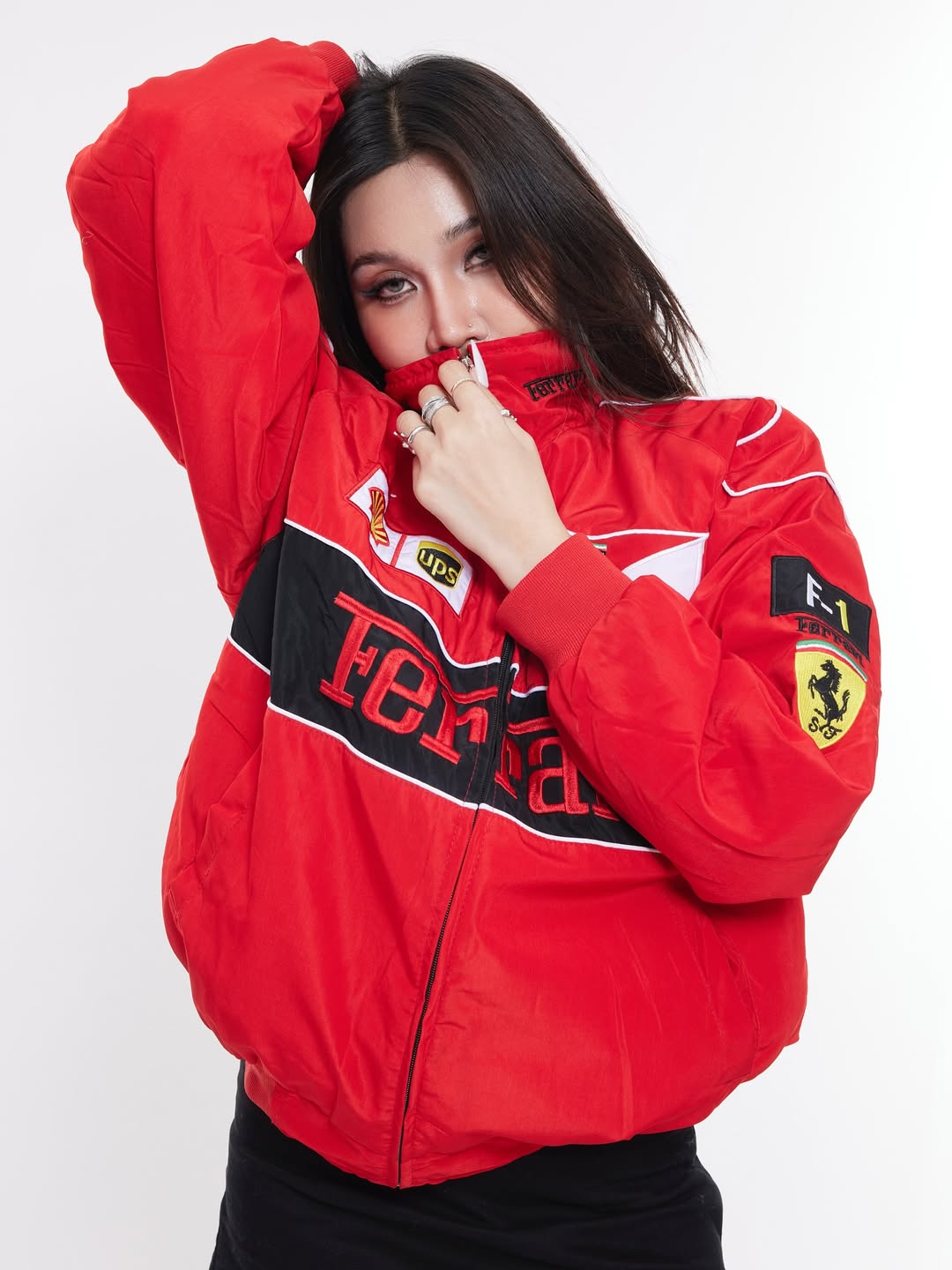 Front view of red Ferrari jacket embroidered by Gigavibe, premium motorsport streetwear.