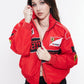 Model styling Gigavibe red Ferrari embroidered jacket zipped up with Ferrari racing embroidery.