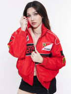 Model styling Gigavibe red Ferrari embroidered jacket zipped up with Ferrari racing embroidery.