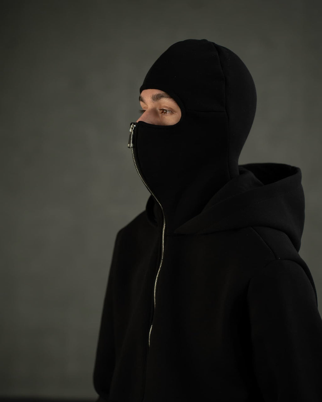 Model wearing black balaclava zip hoodie – premium cotton streetwear fit