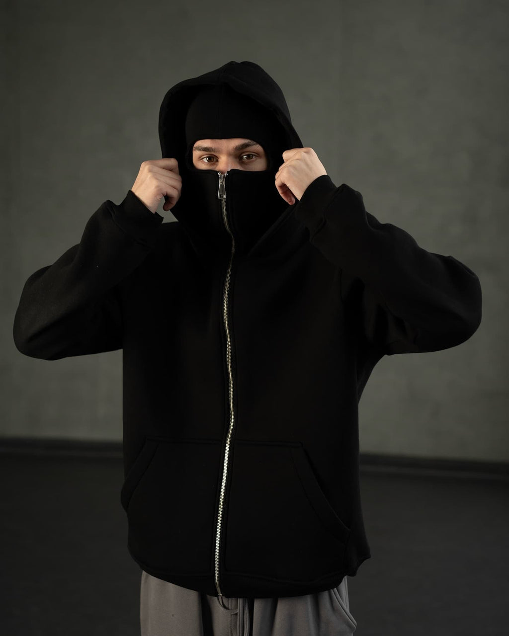 Streetwear outfit featuring Gigavibe black balaclava hoodie and cargo pants