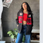 Model showcasing the black retro bomber jacket in a relaxed streetstyle pose. Highlights the jacket as the ultimate lightweight Scuderia merchandise streetwear style, worn effortlessly unzipped for summer aerodynamic airflow.