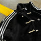 Close up detail of traditional knot buttons on the Gigavibe Black CNY Jacket