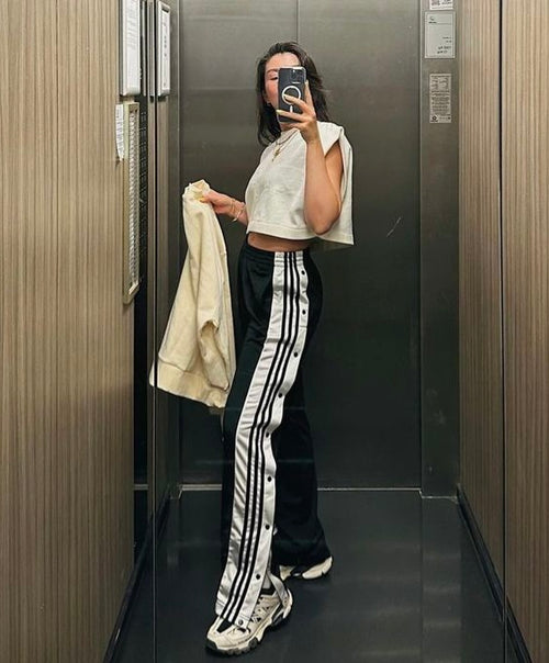 Unisex black streetwear pants with side snap buttons