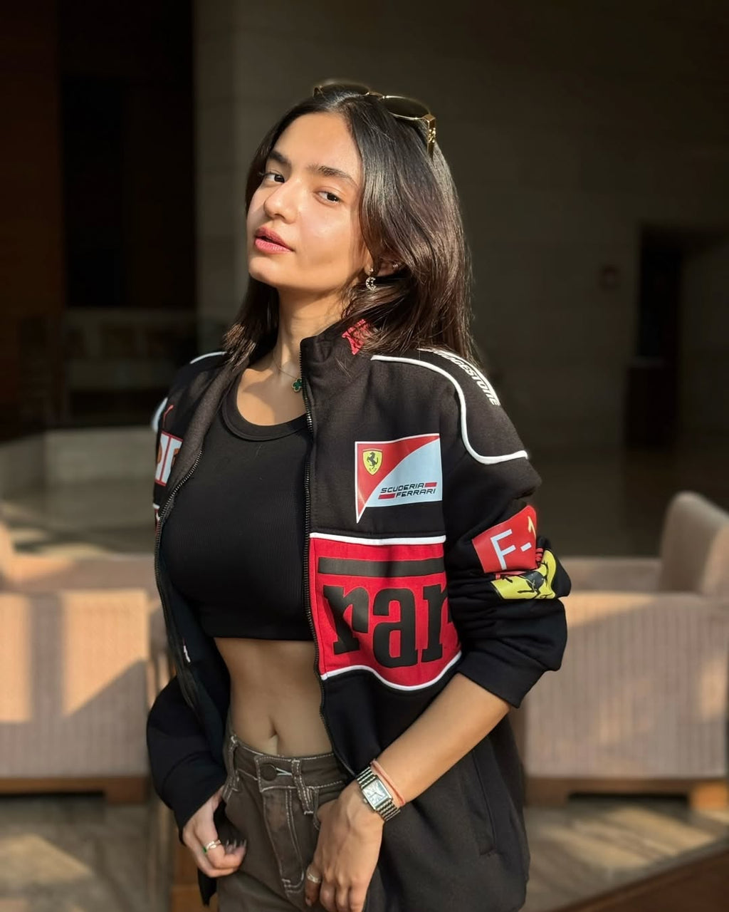 Anushka Sen in a sleek Black Ferrari Jacket, showcasing a trendy motorsport-inspired look.