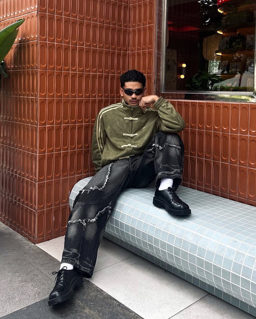 Casual pose featuring the couple wearing the heavy vegan suede jackets entirely open over dark streetwear layers. Proves the absolute dominance of the oversized silhouette for any body proportion.