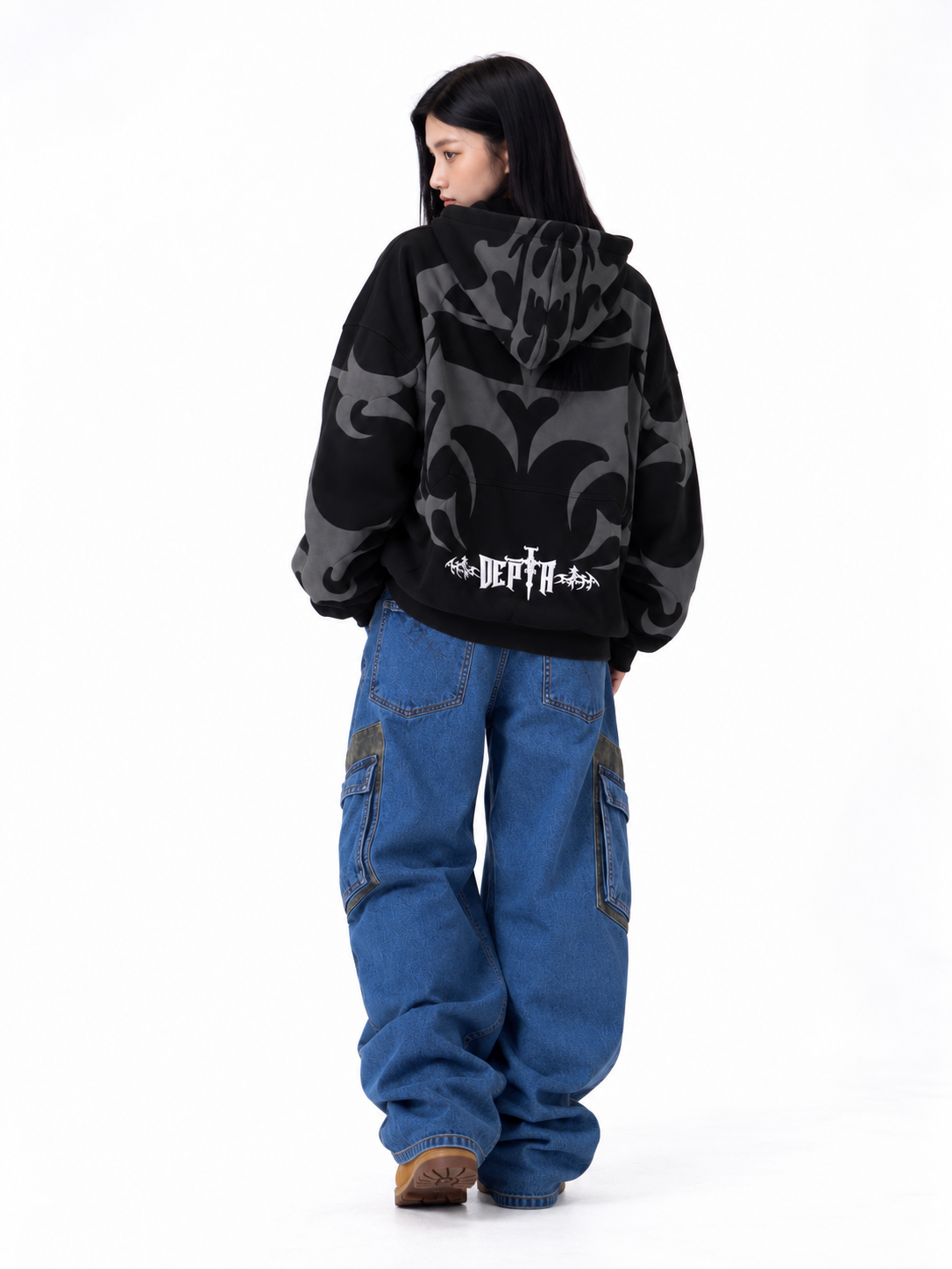 Detailed back view of the black Depth hoodie, displaying the raised rubberized 3D puff print graphics