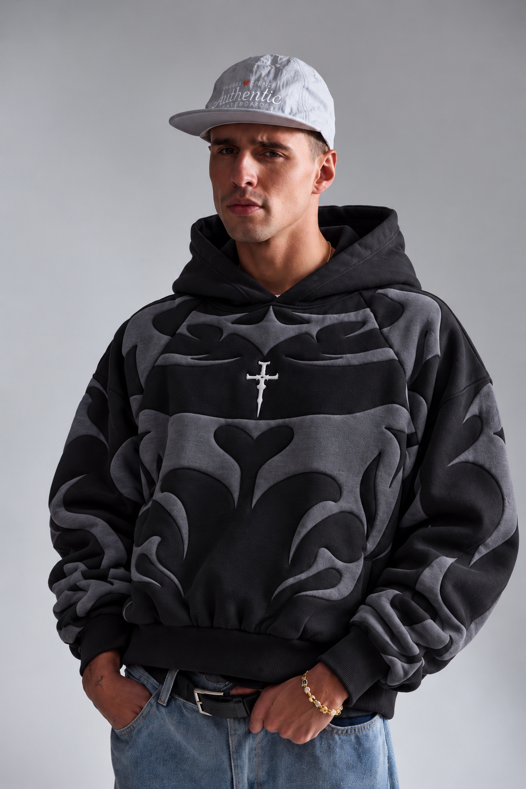 Male model wearing the black Gigavibe tribal depth hoodie, showcasing the heavy 400 GSM winter drape