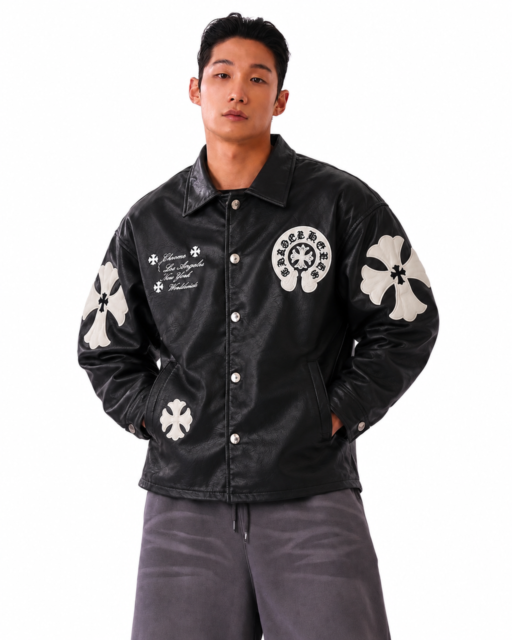Male model wearing the Midnight Black Gothic cross patch faux leather jacket by Gigavibe, highlighting the monochrome dark luxury aesthetic