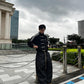Male model wearing the Gigavibe Black Tang jacket with traditional knot closures