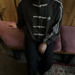 Female model wearing the viral Gigavibe Black Tang jacket streetwear