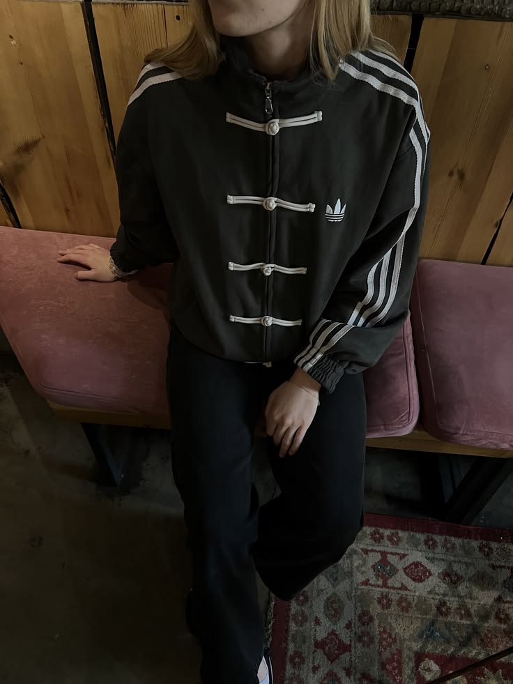 Female model wearing the viral Gigavibe Black Tang jacket streetwear