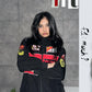 Direct front view of the premium premium printed Ferrari racing streetwear jacket fully zipped. Displays the iconic Ferrari horse logo graphic, chest sponsors, and the boxy aerodynamic silhouette of standard Bikercore aesthetics.