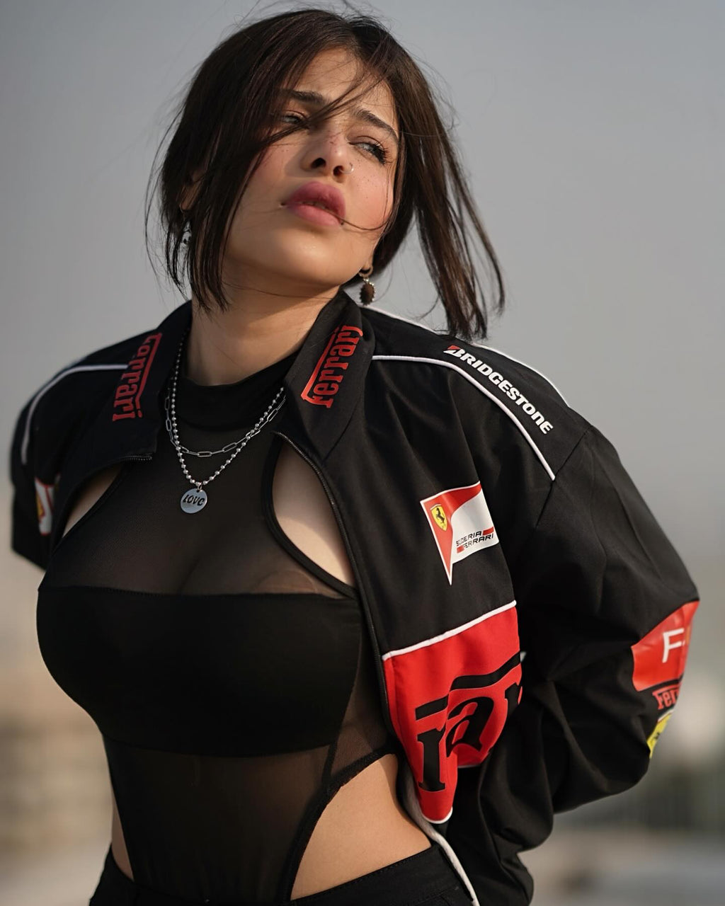 Side profile of Ferrari F1 vintage jacket in black streetwear style