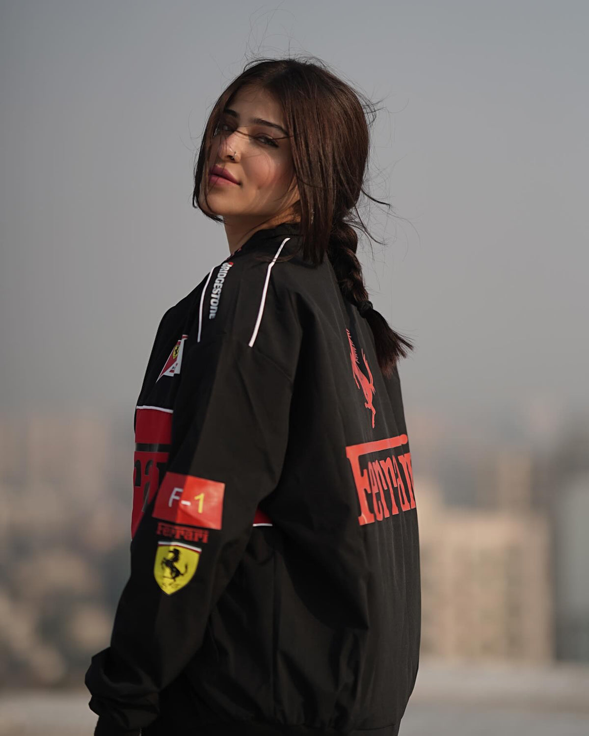 Back view of Black Ferrari racing jacket featuring printed Ferrari logo
