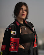 Model Edin Rose wearing Black Ferrari F1 vintage racing jacket – unisex fit