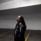 Side view of Jack Daniels embroidered racing jacket by Gigavibe, featuring motorsport-inspired patches and embroidery.