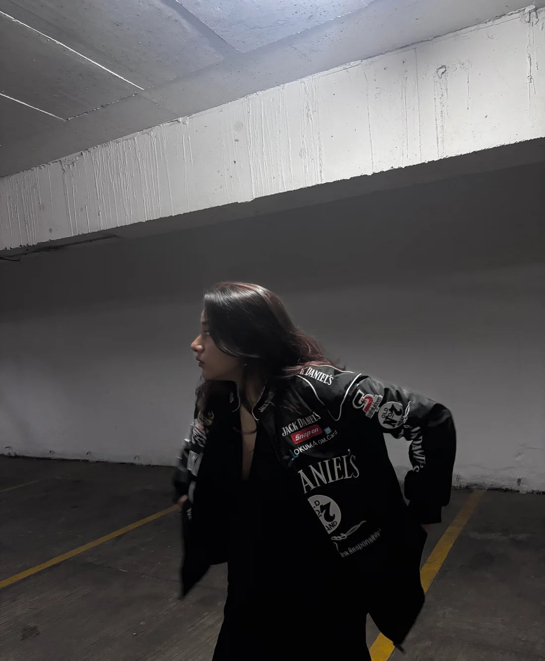 Jack Daniels embroidered bomber jacket by Gigavibe, highlighting detailed patches and vintage racing fashion.
