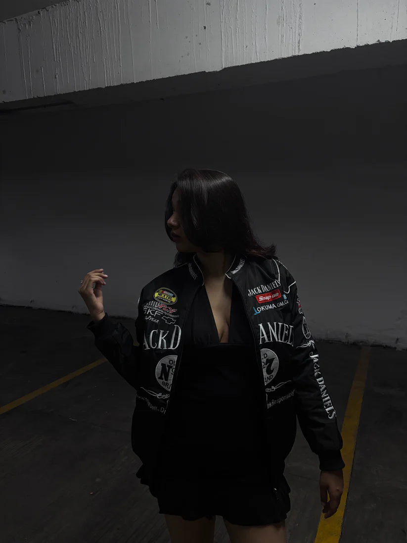 Model styling Jack Daniels embroidered racing jacket unisex by Gigavibe, inspired by NASCAR embroidered jackets.